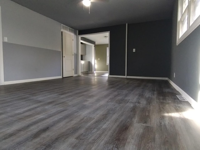 spare room featuring dark hardwood / wood-style floors