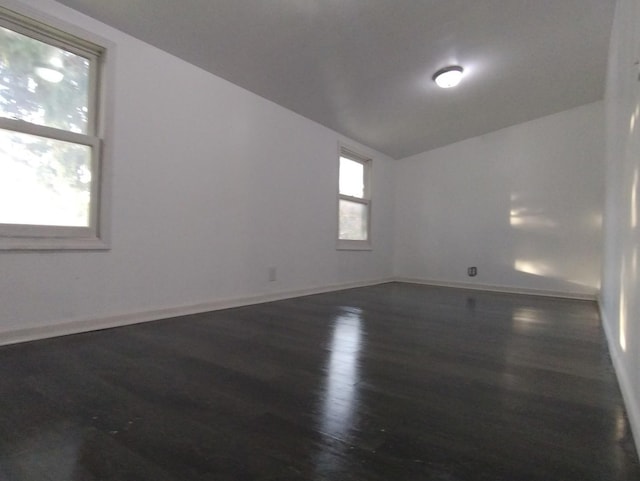 spare room featuring dark hardwood / wood-style flooring