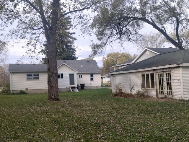 back of house with a yard