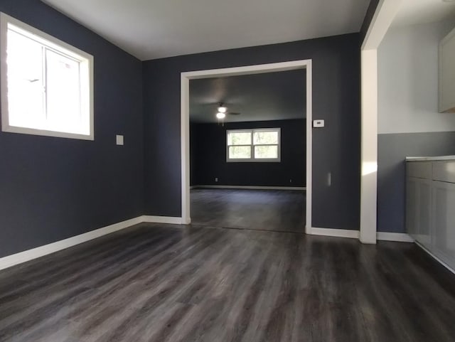 unfurnished room featuring dark hardwood / wood-style flooring