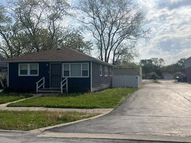 16529 Green St, Harvey, IL 60426 - bungalow-style house with roof with shingles