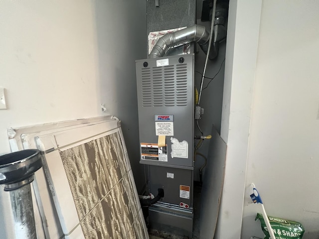 16529 Green St, Harvey, IL 60426 - utility room featuring heating unit