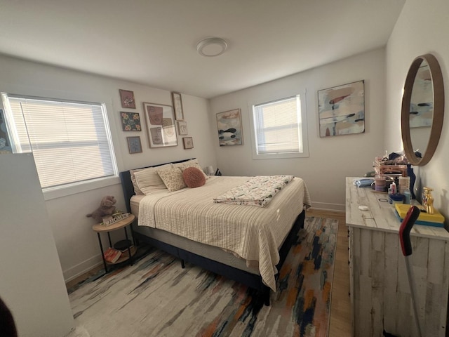 bedroom with hardwood / wood-style floors