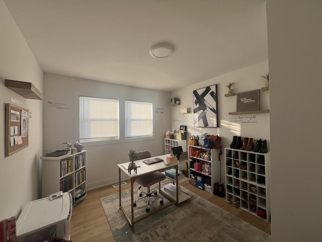 office area with hardwood / wood-style floors