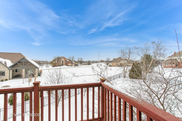 view of snow covered deck