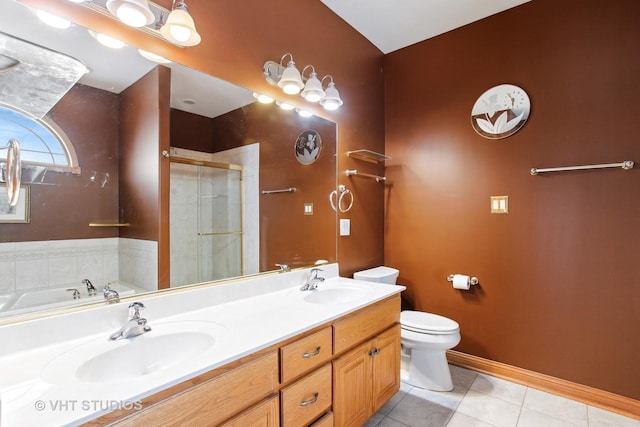 full bathroom featuring vanity, toilet, tile patterned floors, and shower with separate bathtub