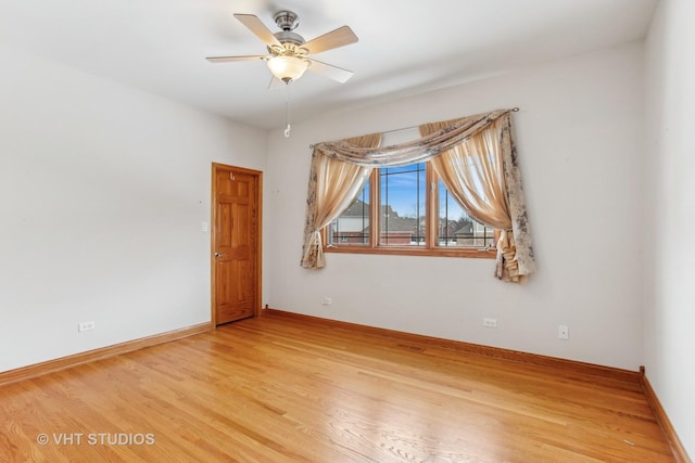 unfurnished room featuring ceiling fan and hardwood / wood-style floors