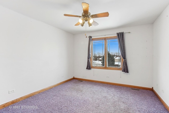 unfurnished room featuring ceiling fan and carpet flooring