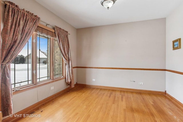 unfurnished room featuring light wood-type flooring