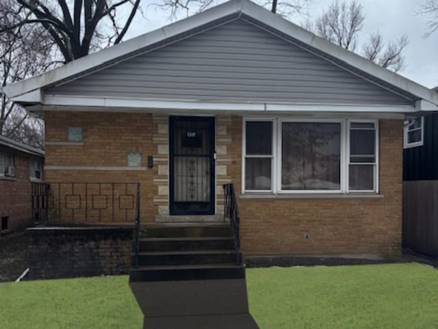 view of front of home with a front lawn