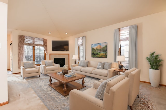 living room featuring a fireplace and vaulted ceiling