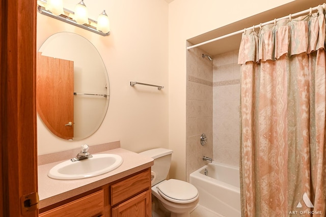 full bathroom with vanity, toilet, and shower / tub combo