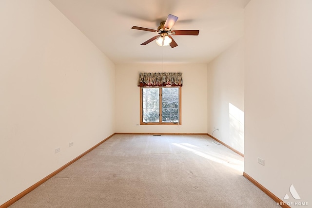 carpeted empty room featuring ceiling fan