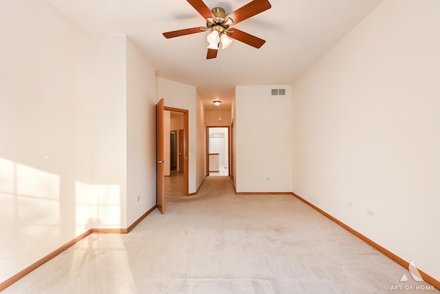 spare room featuring carpet flooring and ceiling fan