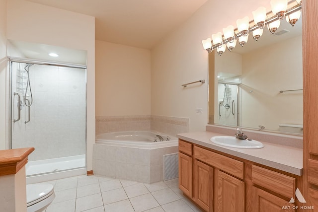 full bathroom with toilet, vanity, tile patterned floors, and separate shower and tub