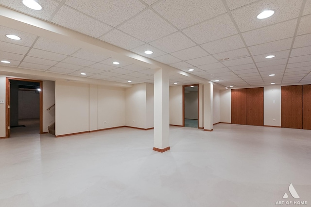 basement featuring a paneled ceiling