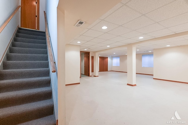 staircase featuring a paneled ceiling