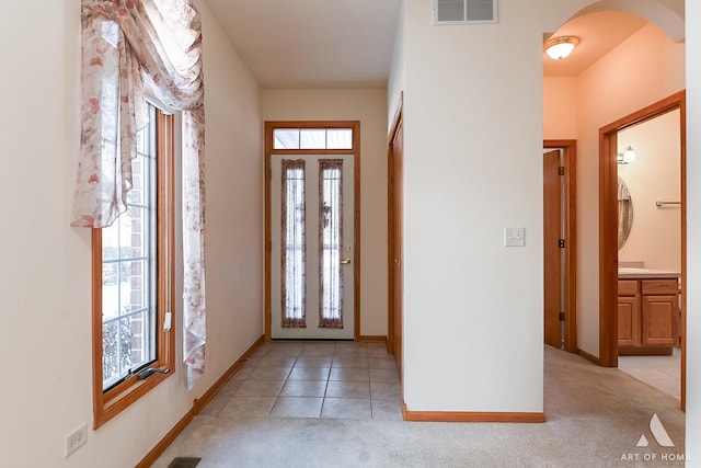 view of carpeted entrance foyer