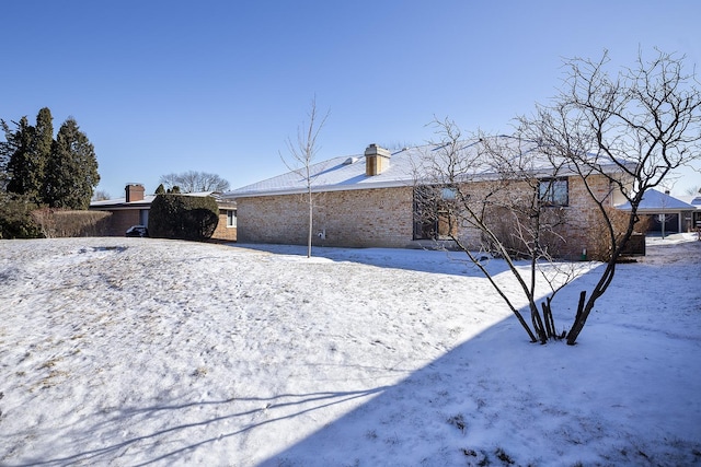 view of yard covered in snow