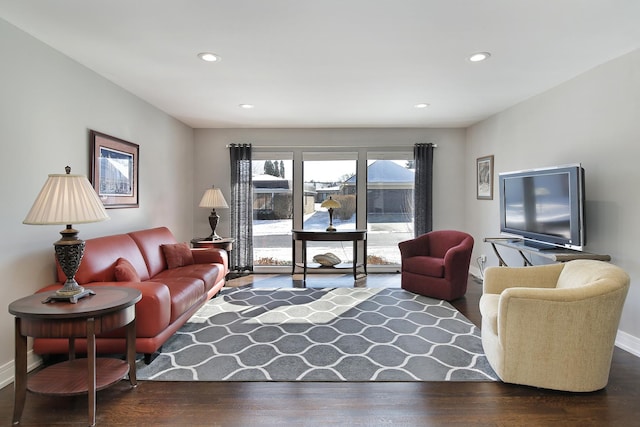 living room with dark hardwood / wood-style floors