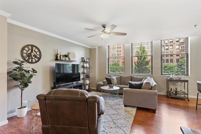 living room featuring ceiling fan, dark wood-type flooring, and crown molding