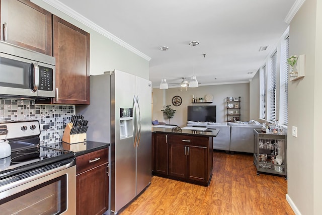 kitchen with ceiling fan, decorative backsplash, light hardwood / wood-style flooring, ornamental molding, and stainless steel appliances