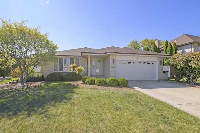 single story home featuring a garage and a front lawn