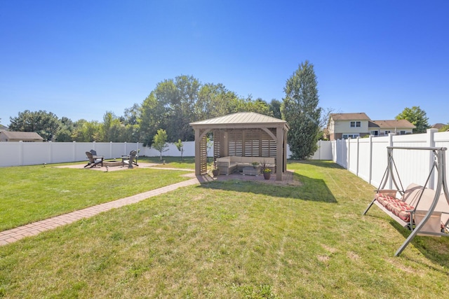 view of yard with a fire pit and a gazebo