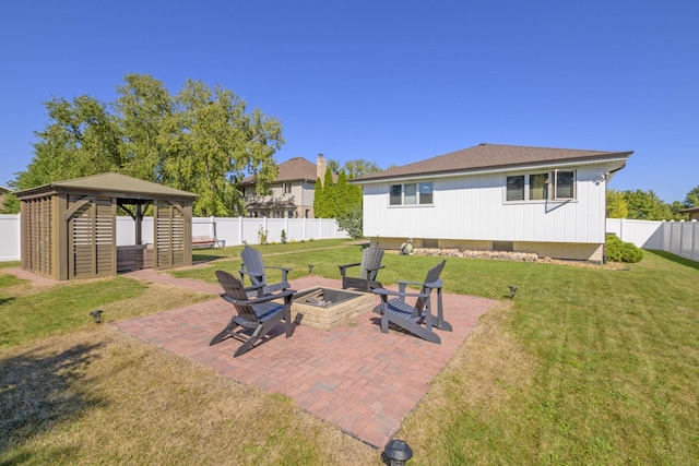 view of patio / terrace featuring a gazebo and a fire pit