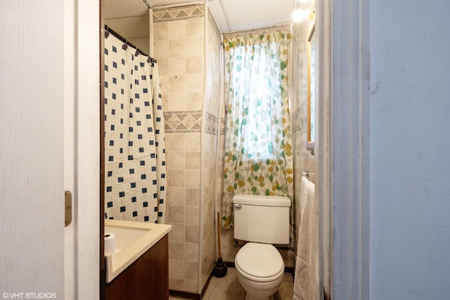 bathroom featuring tile walls, toilet, and vanity