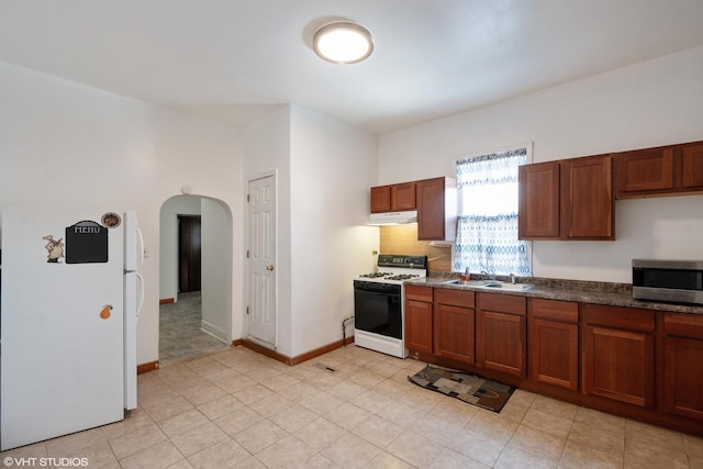 kitchen with sink and white appliances