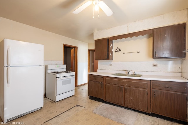 kitchen with ceiling fan, sink, and white appliances