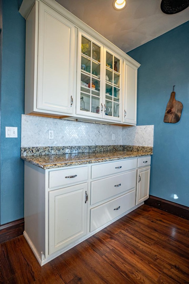 kitchen featuring white cabinetry and dark hardwood / wood-style floors