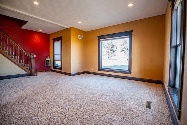 unfurnished living room with carpet