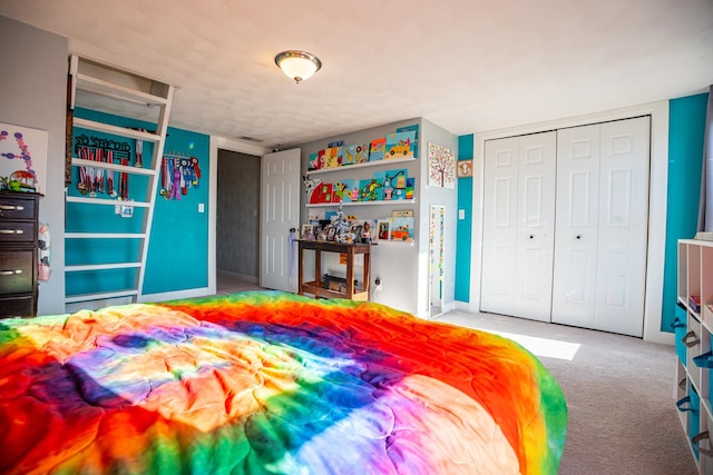 bedroom featuring light colored carpet and a closet