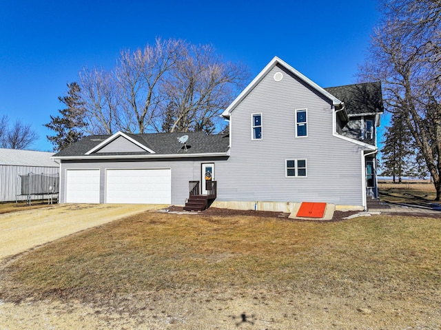 exterior space featuring a garage and a lawn