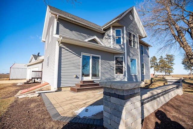 rear view of property with a patio