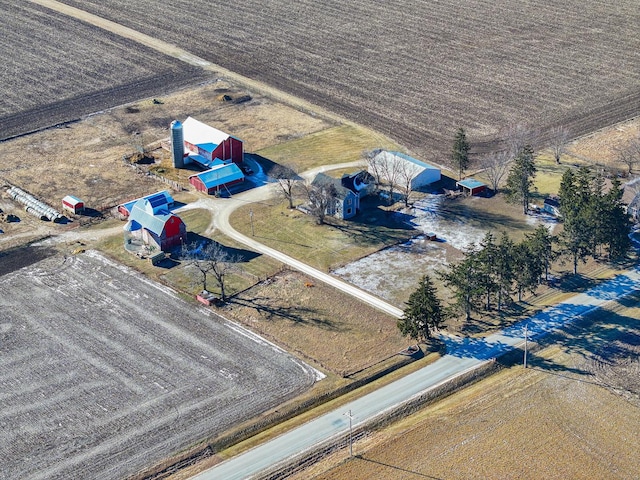 birds eye view of property with a rural view