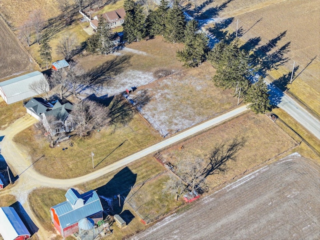 birds eye view of property with a rural view