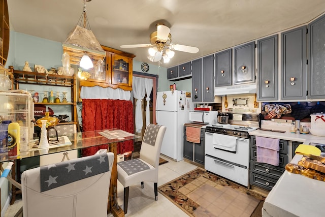 kitchen with white appliances, decorative light fixtures, ceiling fan, and light tile patterned flooring