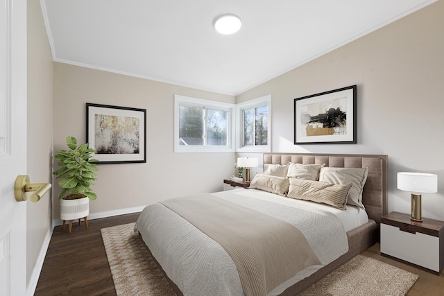 bedroom with crown molding and dark wood-type flooring