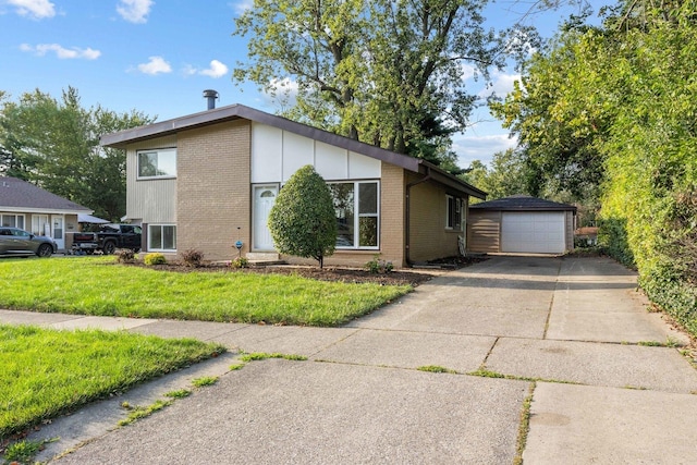 view of front facade featuring an outbuilding, a garage, and a front lawn