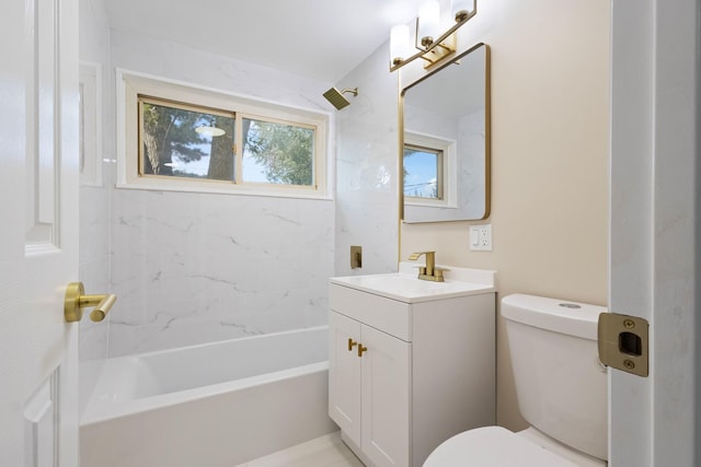 full bathroom with vanity, toilet, and tiled shower / bath