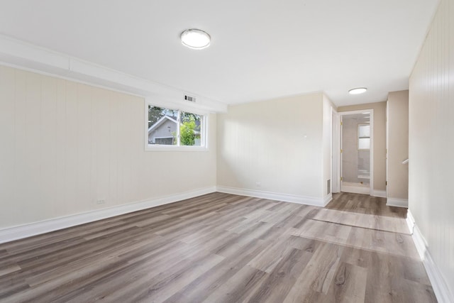 unfurnished room with light hardwood / wood-style flooring