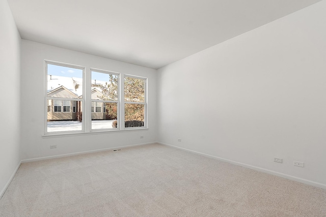 empty room featuring light colored carpet