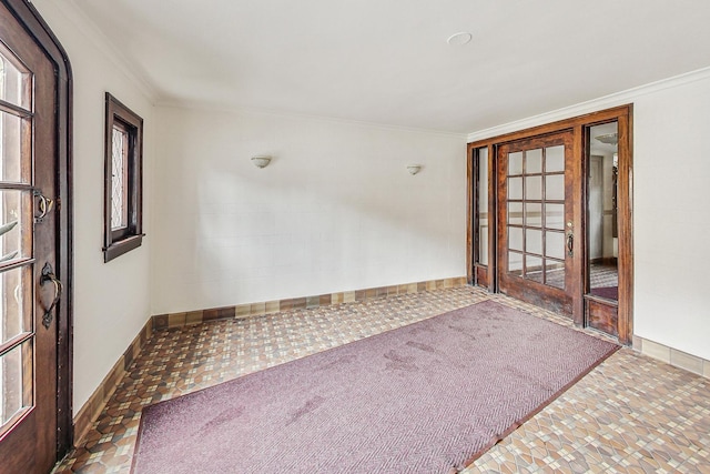 unfurnished room featuring a wealth of natural light, crown molding, and carpet flooring