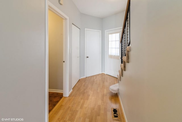 hall with light hardwood / wood-style flooring