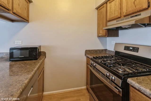 kitchen featuring gas stove and light hardwood / wood-style floors