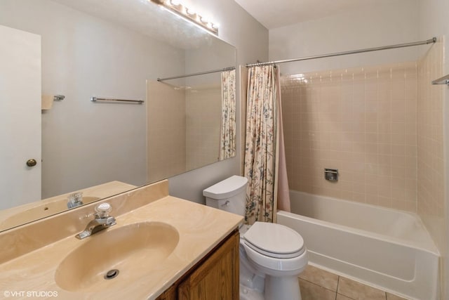 full bathroom featuring toilet, shower / bath combo, vanity, and tile patterned floors