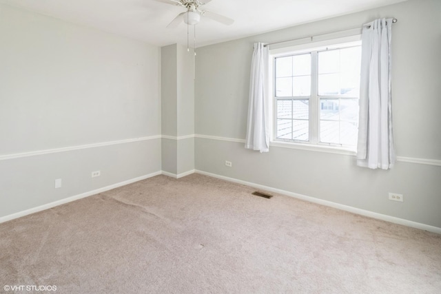 carpeted empty room with ceiling fan